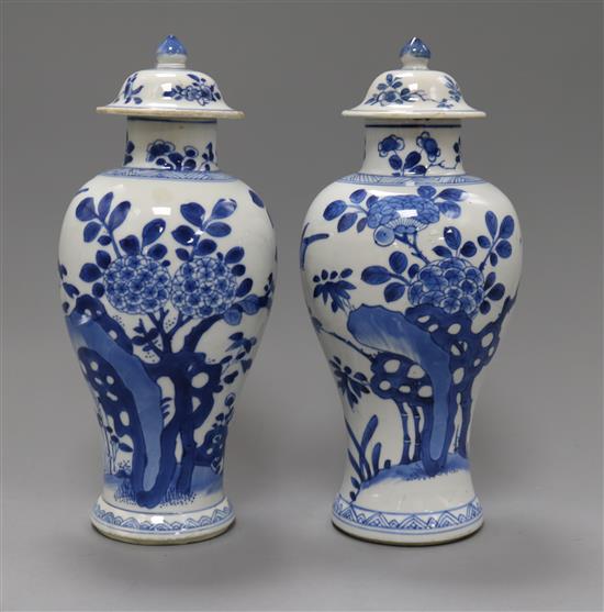 A pair of Chinese blue and white vases and covers, kangxi period Height 26cm